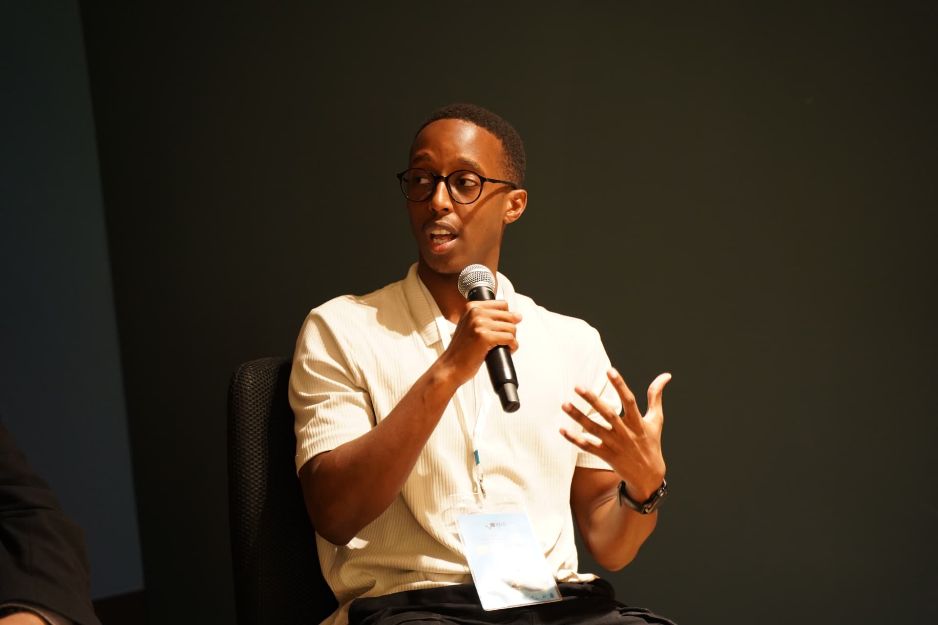 Darren Baine speaking on stage